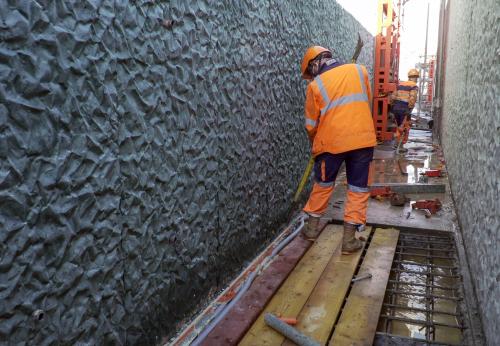 Iconographie - Chantier A10 sur un mur matricé avec Hoffmann Green