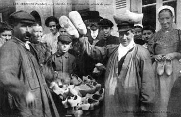 Iconographie - Le marché. Un marchand de sabot du pays